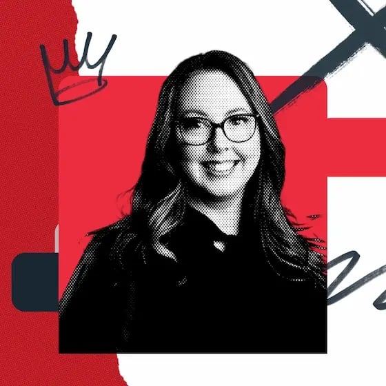 Ashley Judge, a smiling woman with glasses